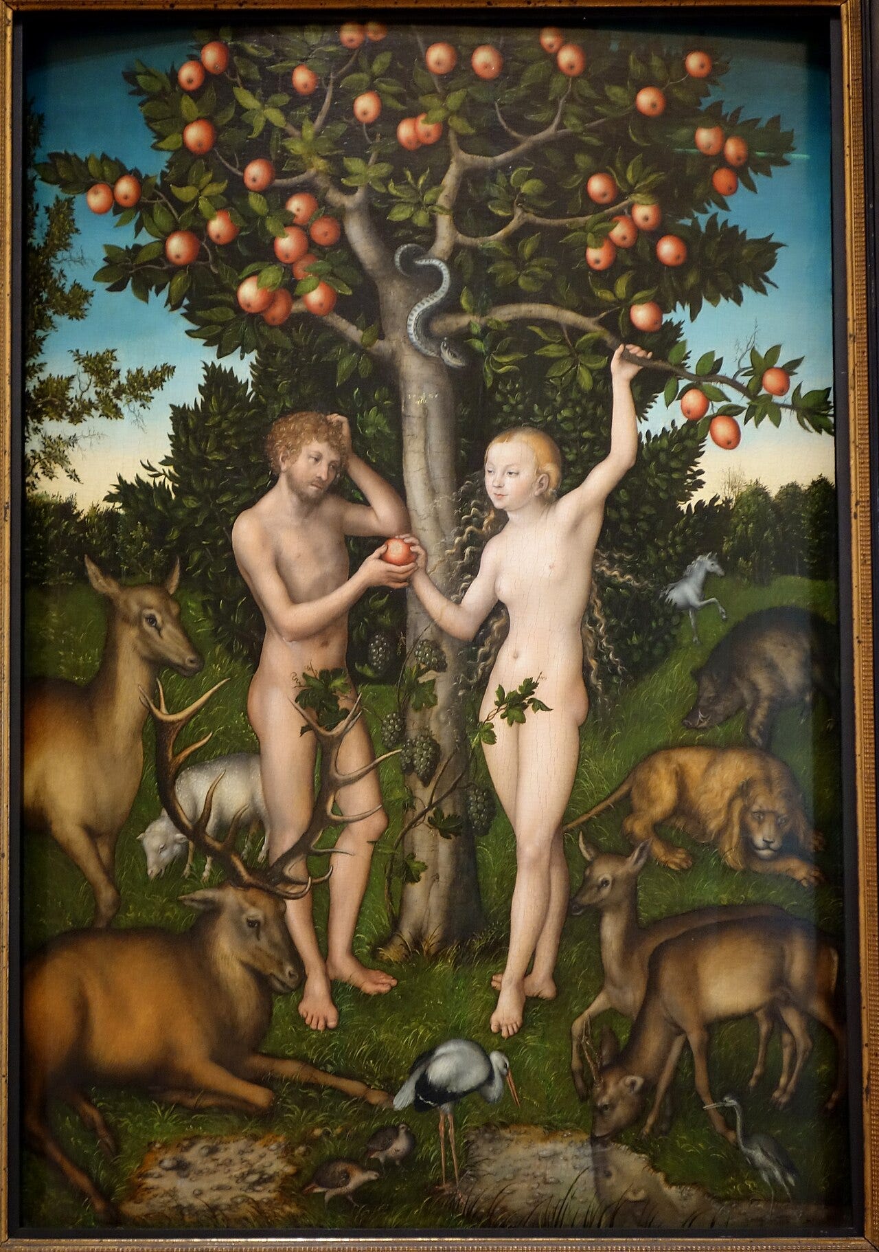 Adam and Eve under the tree with a serpent coiled in the branches