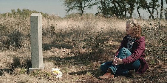 ABilene sitting on ground at Marvs grave on Walker. ABilene sitting on ground at Marvs grave on Walker.