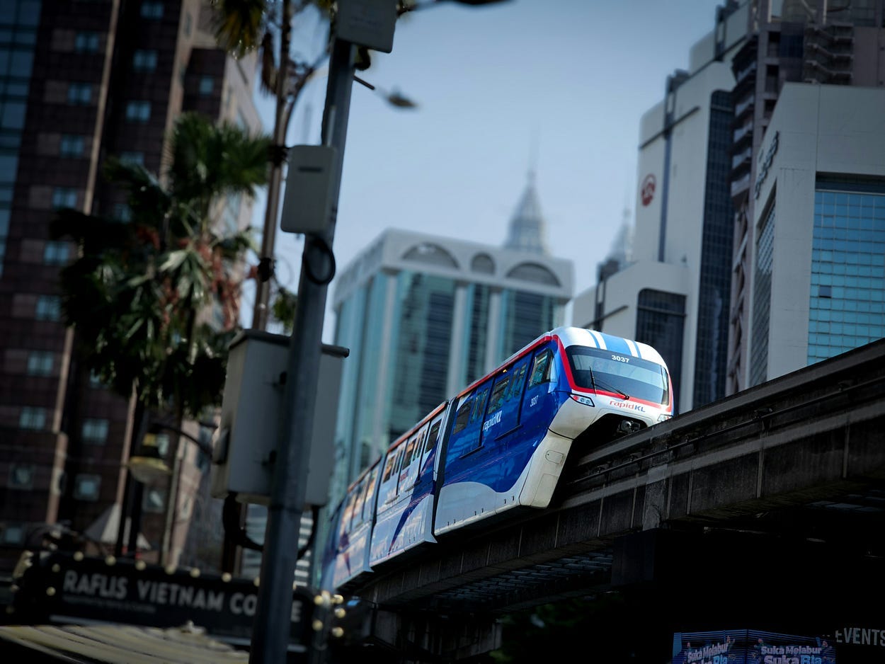 An electric train makes its way through a city, running on sustainable energy. It could help fight climate change by reducing our need for fossil fuels.