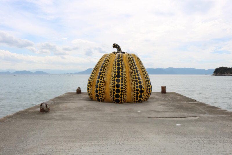 Yayoi Kusama's Yellow Pumpkin on its pier on Naoshima