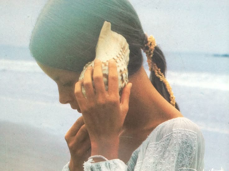 This may contain: a woman holding a baseball glove to her face