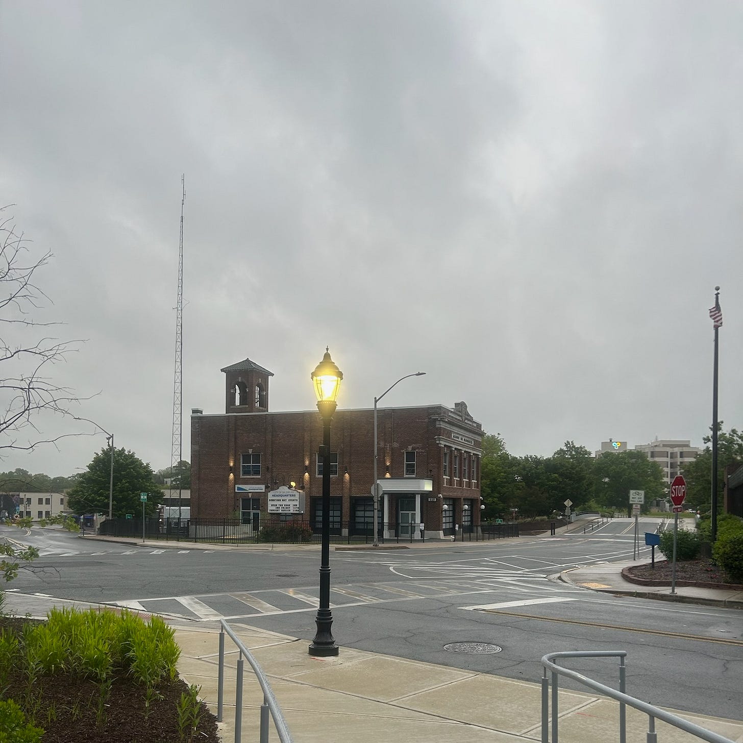 A street light stands at the corner of a city street near the Salisbury headquarters, illuminated during an approaching storm. A street light stands at the corner of a city street near the Salisbury headquarters, illuminated during an approaching storm.