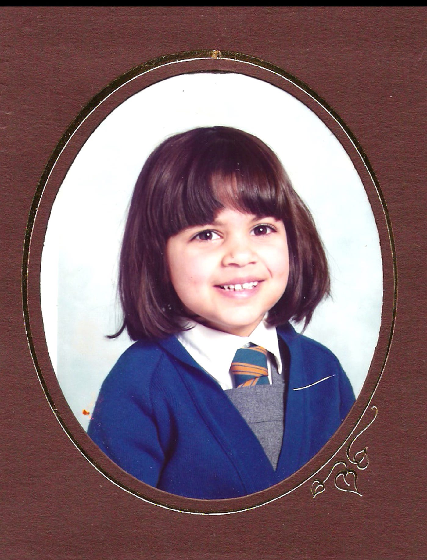a young girl in school uniform