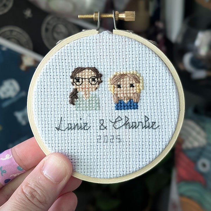 A photograph of one of the above cross-stitches where one of the names has been re-stitched.