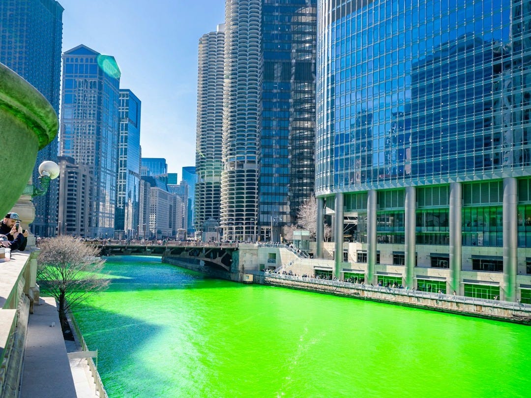 body of water near high rise buildings during daytime