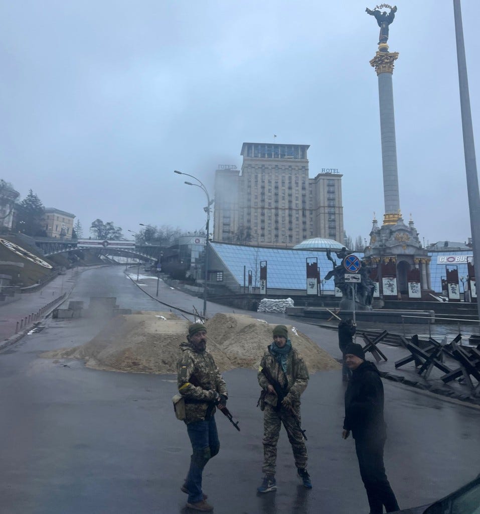 Ukrainian civilians patrol the streets with guns.