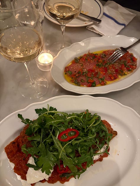 A plate of grilled cheese, plates on a restaurant table