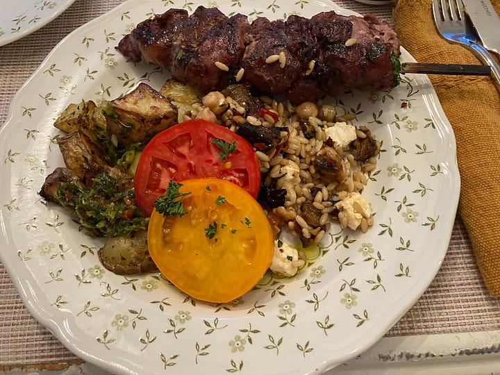 Grilling hamburgers, chicken, vegetables and peaches