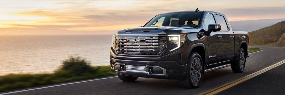2023 GMC Light Duty Truck driving on mountain side