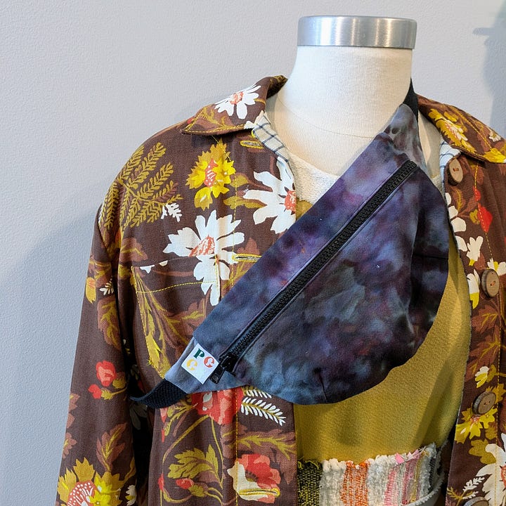 a cross body bag on display, a detail from an indigo dyed fabric
