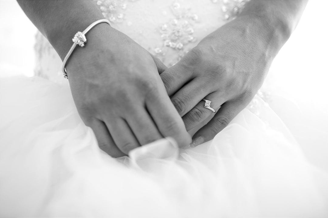 bride and groom holding hands