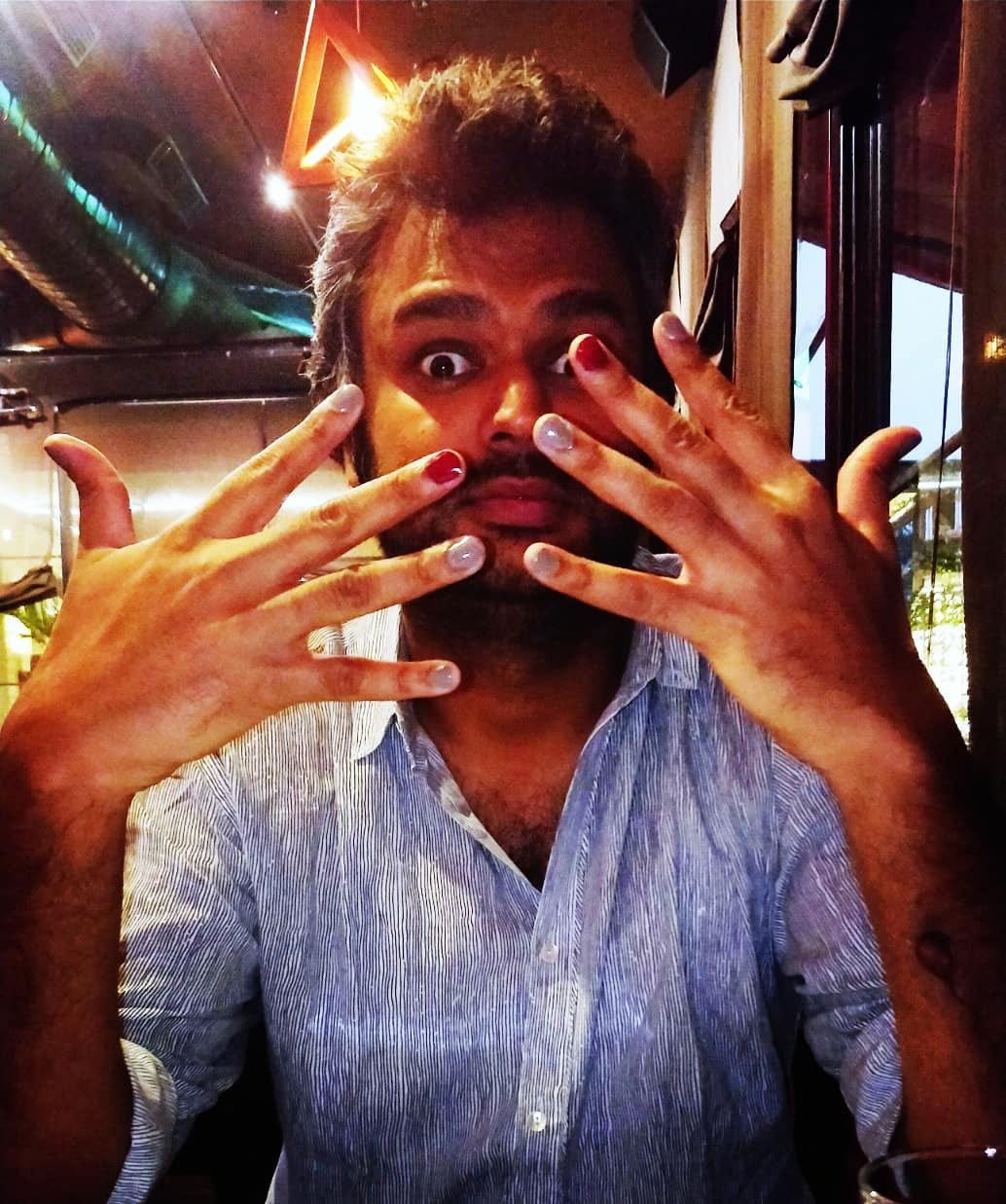 A man with painted nails