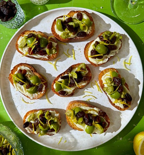 Collage of 7 easy summer appetizer recipes including golden fried zucchini blossoms, crispy eggplant rounds, loaded smashed potatoes, corn rangoons, panko-crusted goat cheese balls, pea fritters, and olive crostini - all ready in 30 minutes or less