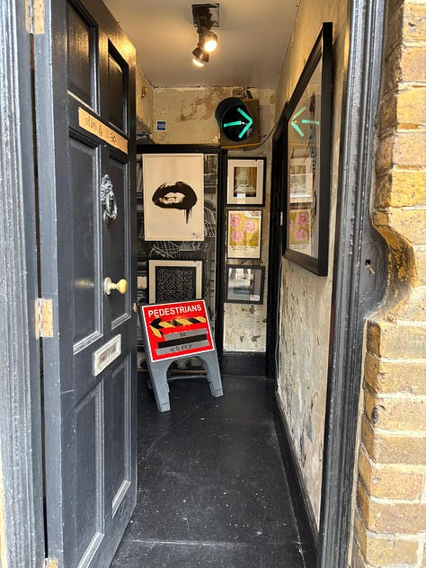 From a quiet street in Deal to the narrow hallway and intimate rooms beyond, the Walk Don't Walk Gallery invites visitors to step inside, be nosey, and discover an art space where humour, conversation and curiosity shape the experience as much as the works on the walls. — © Kent Chronicles