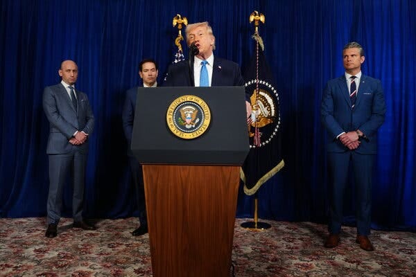 President Trump at a lectern with the presidential seal flanked by Stephen Miller, Marco Rubio and Pete Hegseth. President Trump at a lectern with the presidential seal flanked by Stephen Miller, Marco Rubio and Pete Hegseth.