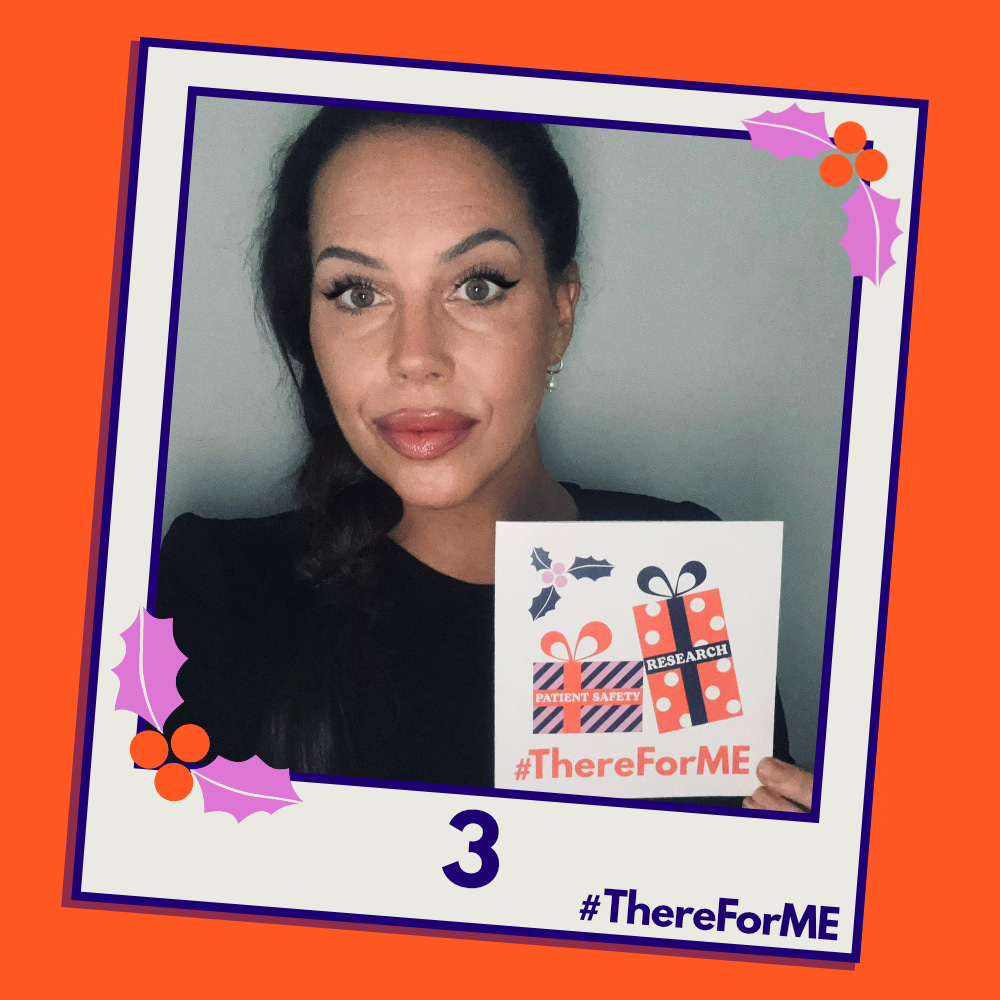 A pretend polaroid shows Natasha Devon posing for a photo holding a #ThereForME Christmas card.  The image on the card shows two presents, one labelled "patient safety", the other "research". The photo is labelled "3". The design is in the #ThereForME colours.