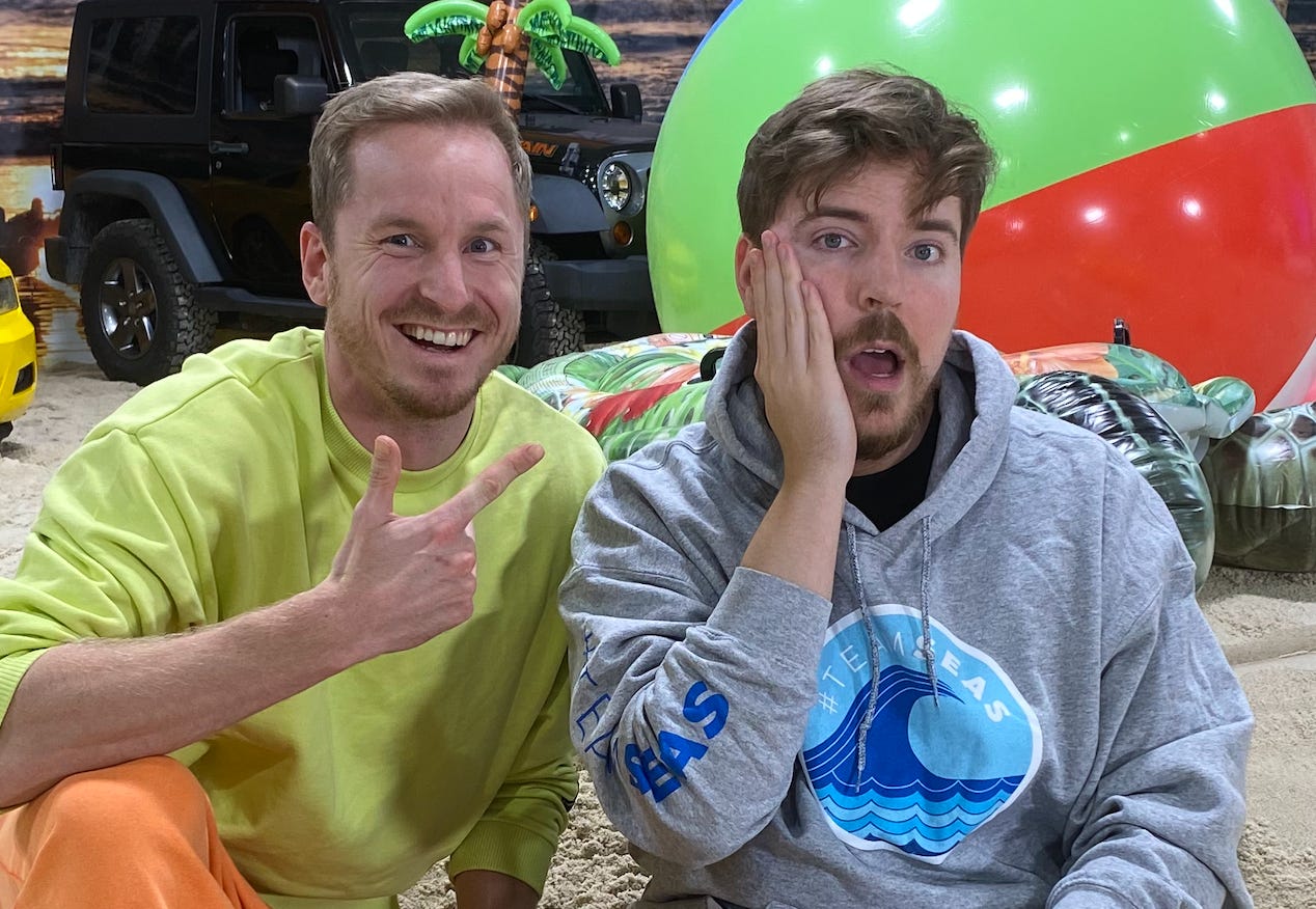 Two men posing for a picture. Two men posing for a picture