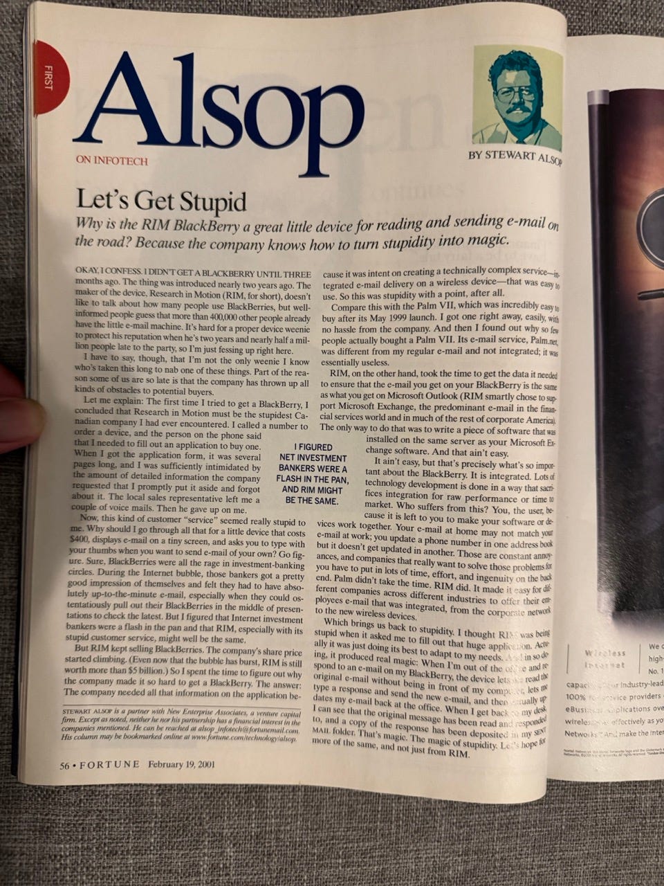 A page from Fortune magazine (February 19, 2001) showing a column titled "Alsop: Let's Get Stupid" by Stewart Alsop, with his photo, discussing the RIM BlackBerry device. A hand holds the magazine open.