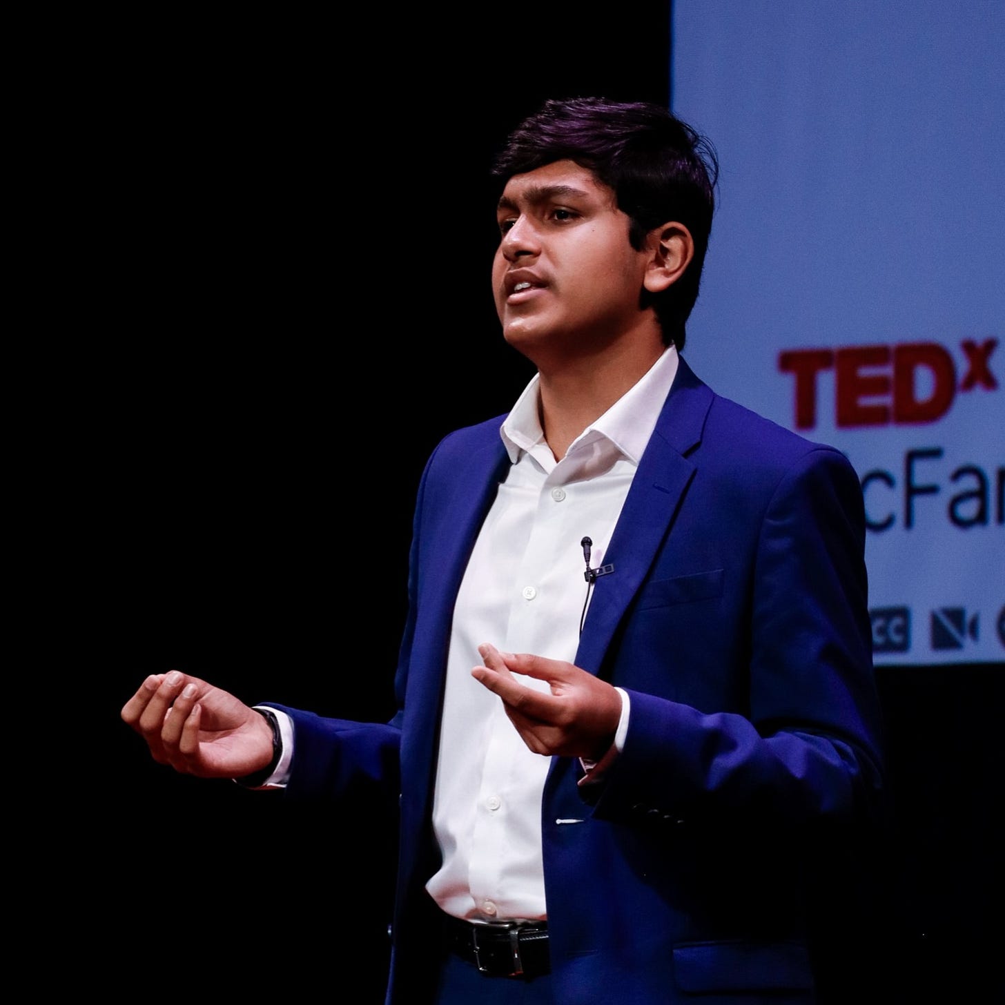 Adil Mukhi speaking at TedX event