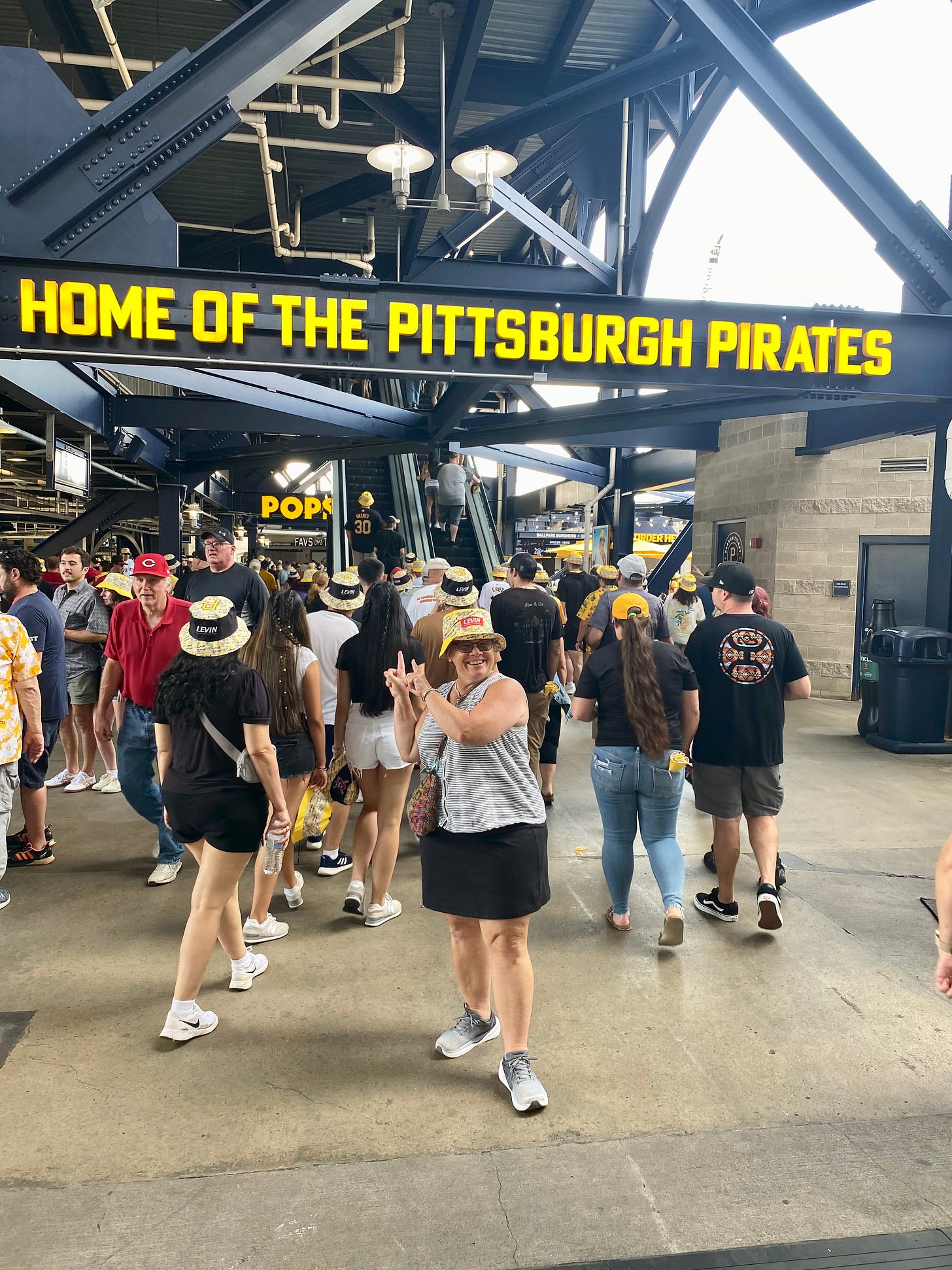 woman in a yellow bucket hat at PNC Park