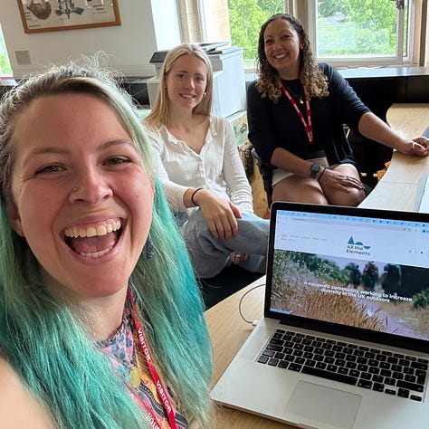 Patsy and Frankie sat at a desk smiling - Patsy, Frankie and Soraya taking a selfie