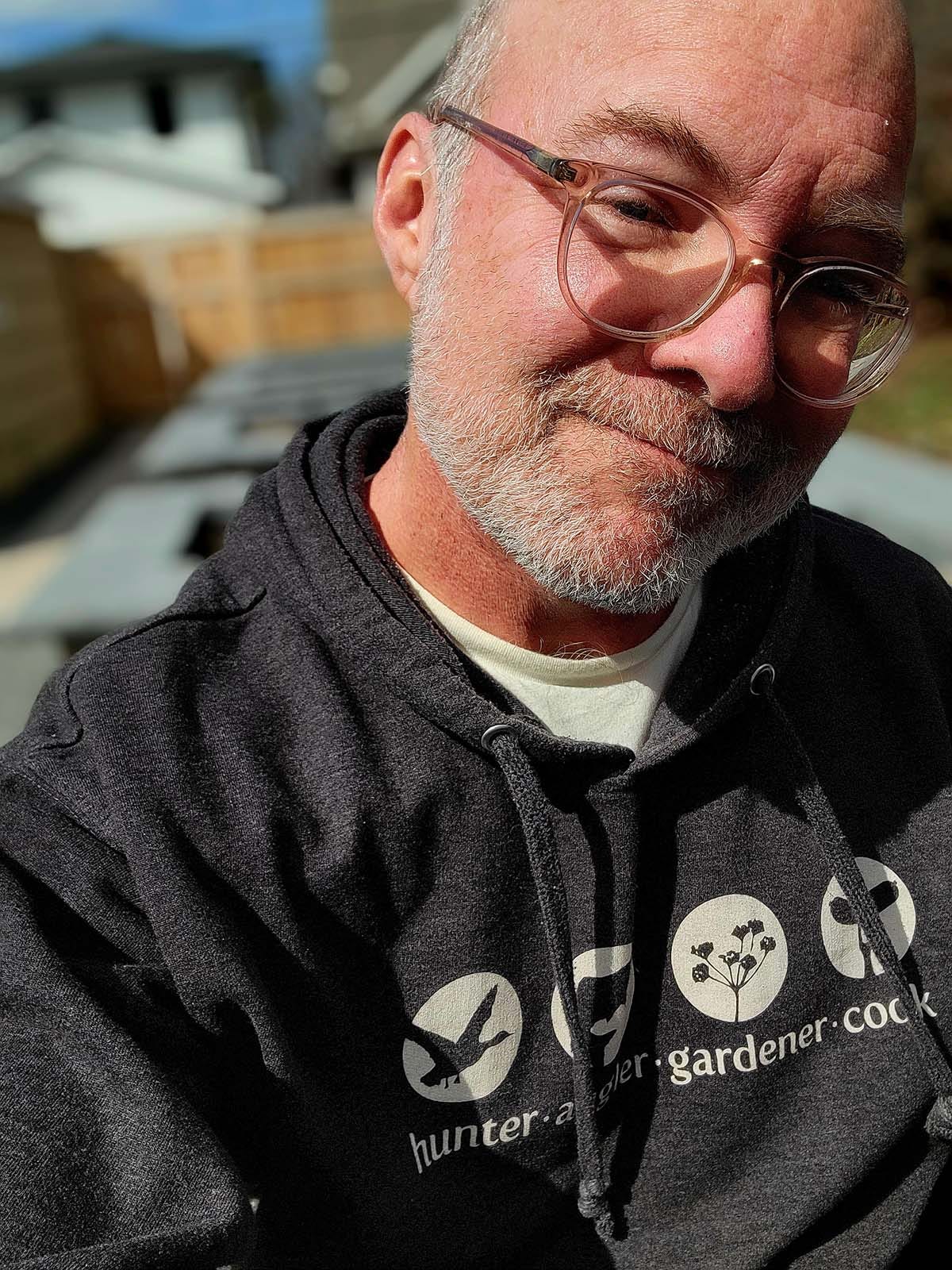 Hank Shaw in front of his garden beds. 