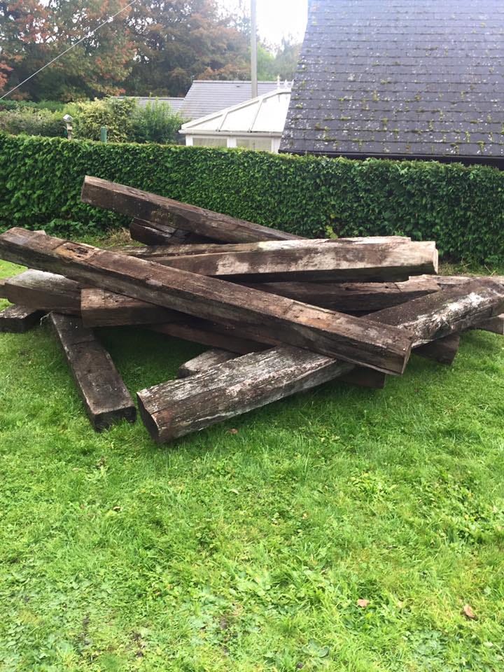 A pile of giant railway sleepers that looks like someone picked them up and just dropped them from a height.