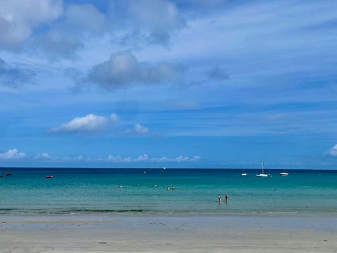 A collection of nine photos taken in Brittany, featuring a group of four friends on a hike and eight scenic coastal landscapes, including lighthouses, cliffs, boats, and traditional villages under varied summer light