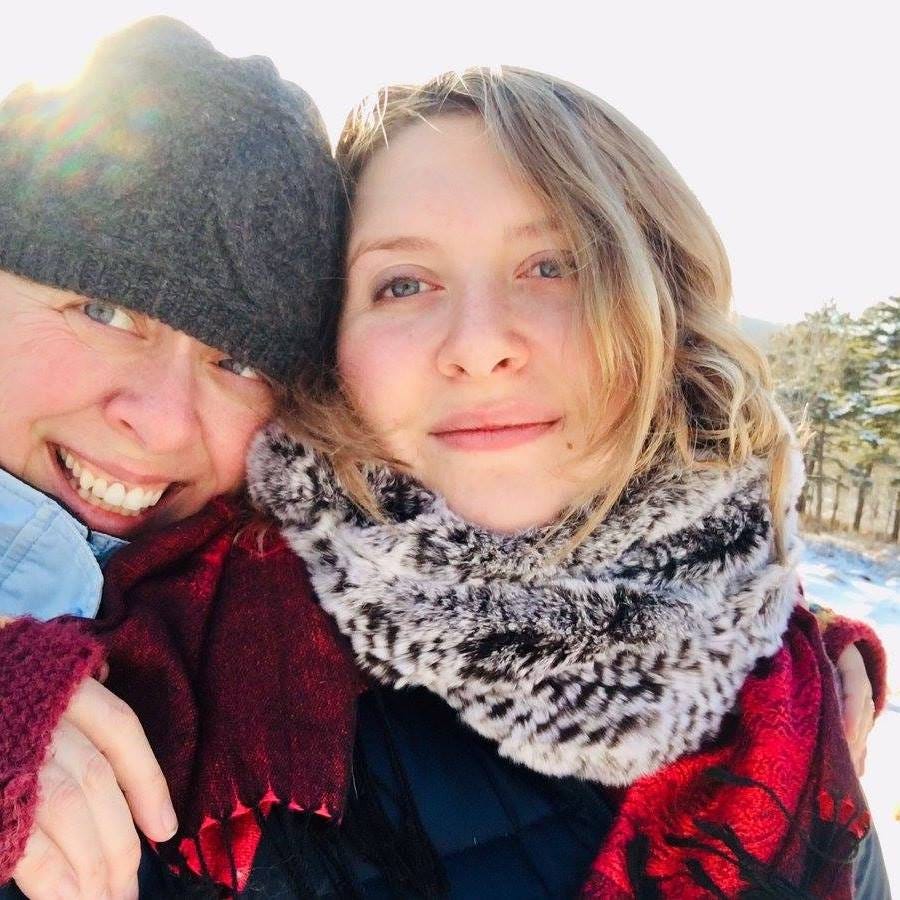May be an image of 1 person, scarf and ski slope