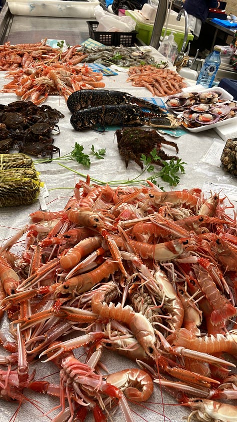 A photo gallery of A Coruña, Spain and Santiago de Compostello, with cathedrals, the Tower of Hercules, and some appetizing seafood