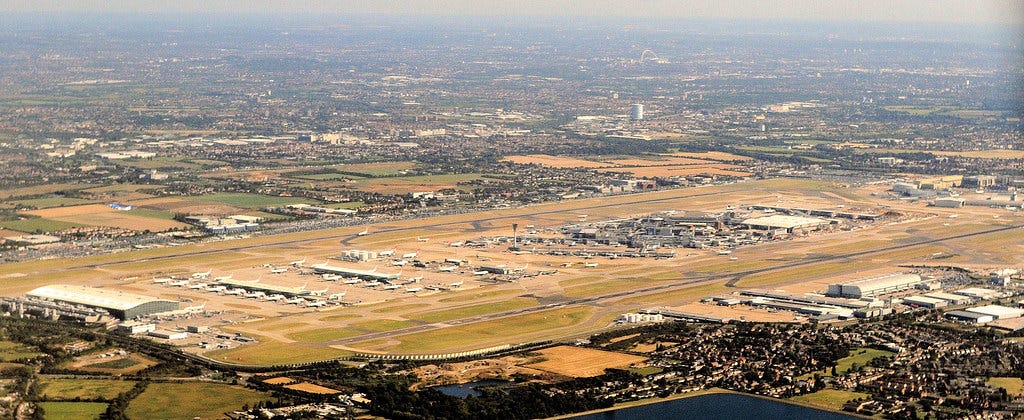 London's Heathrow Airport An image of London Heathrow Airport with its sprawling terminals sandwiched between two runways.