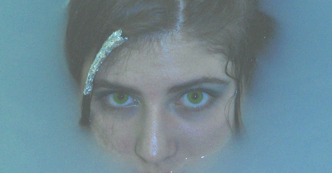 woman with black hair and blue eyes