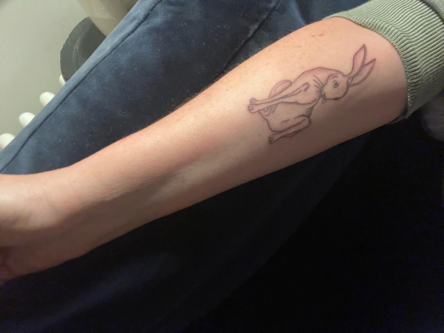 A tattoo on a person's arm

AI-generated content may be incorrect.