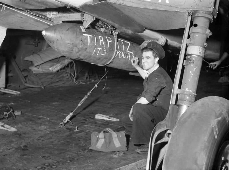 HMS Furious armourer with bomb message April 1944 IWM A 22640