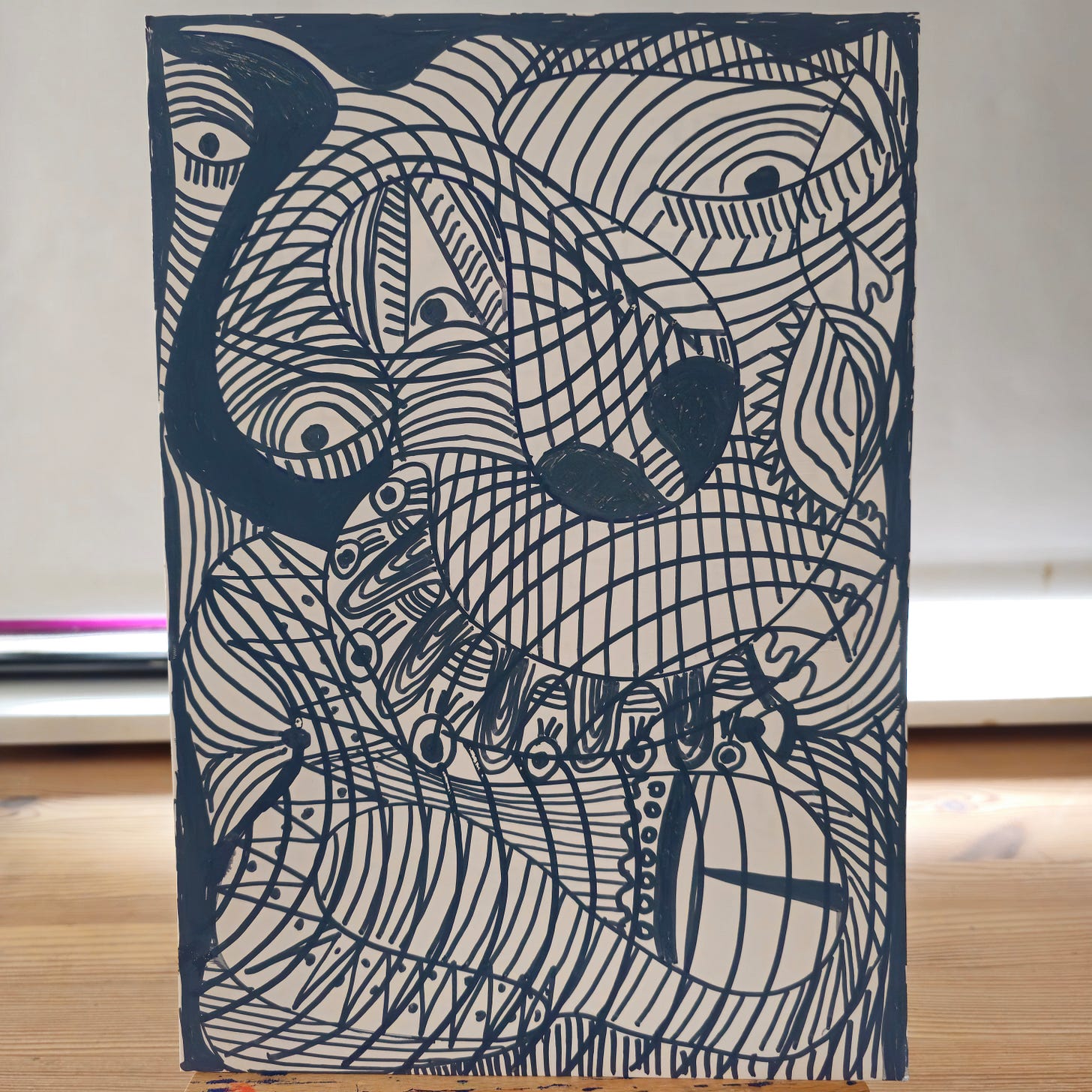 Alt Text: A high-contrast, black-and-white abstract ink drawing by FatbikeHero. The image features dense, swirling lines, geometric grids, and eye-like shapes filling the entire surface of a recycled card.