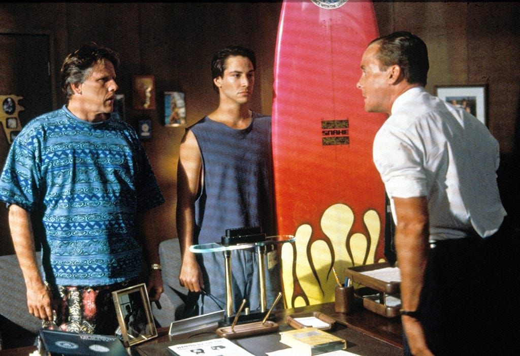 Point Break Johnny Utah pink surfboard FBI office
