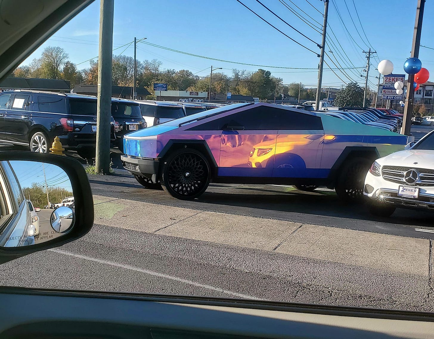 May be an image of jeep, car and text