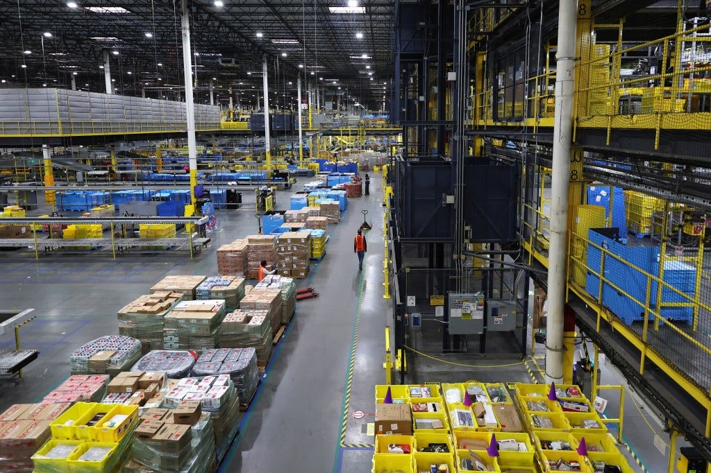 A worker walks through an Amazon fulfillment center during Cyber Monday operations.