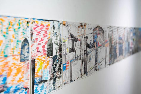 Artist and paintings in exhibition