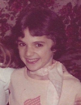 A wallet-sized photo of a 10-year-old girl