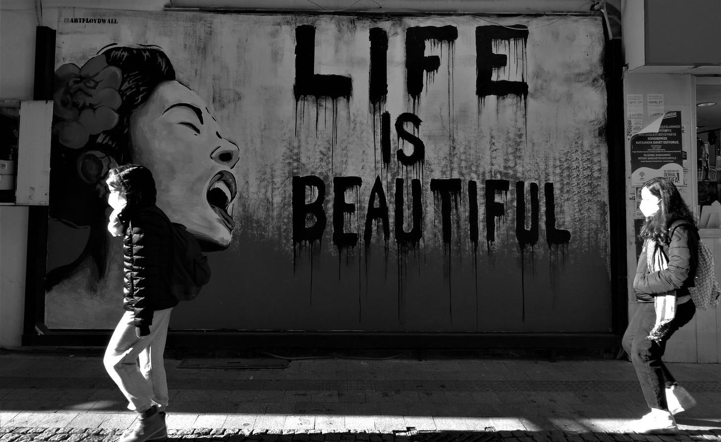 Photo by <a href="https://unsplash.com/@josefkali?utm_content=creditCopyText&utm_medium=referral&utm_source=unsplash">Josef Kali</a> on <a href="https://unsplash.com/photos/two-people-standing-in-front-of-a-wall-with-a-painting-of-a-womans-3bEyNoDfCsc?utm_content=creditCopyText&utm_medium=referral&utm_source=unsplash">Unsplash</a>       