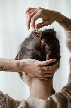 Made by hand out of recycled solid brass in a California studio. This 'u' shaped hair fork is simple and classic. To use, weave through your hair to create tension for an all day hold. Ideal for buns of any style! Details Smooth Finish 4" L x 1" W Crafted from recycled brass in California Brass Care: This piece will naturally darken over time. Always remove before entering pools or hot tubs as chlorine may affect the finish. Buff with a polishing cloth as necessary.