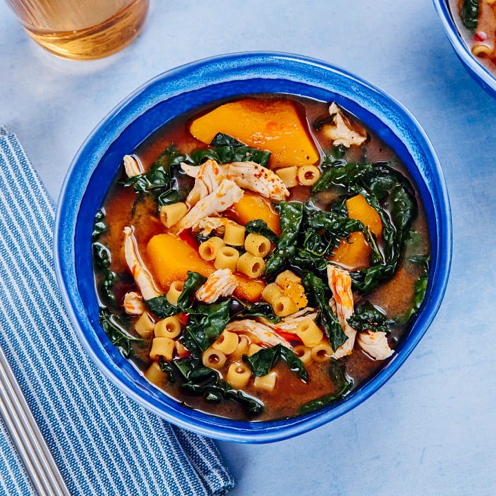 Left: a photo of a bowl of soup with chicken and squash and kale. Right: The cover for the book Onyx Storm.