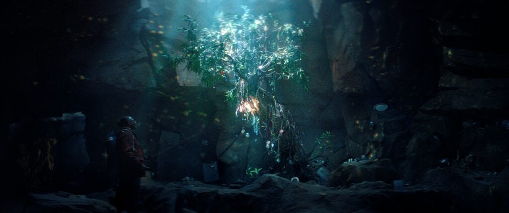 Art find a strange glowing tree inside a cave in The Boroughs on Netflix. 