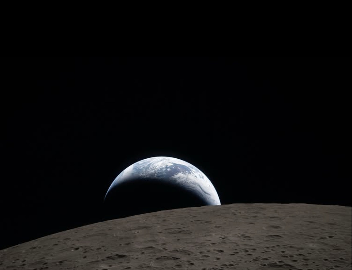 May be an image of eclipse, crater and text