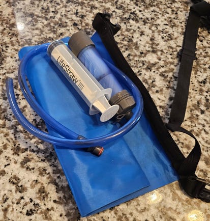 A blue bag with a tube and tubes on it
AI-generated content may be incorrect. A blue bag with a tube and tubes on it
AI-generated content may be incorrect.