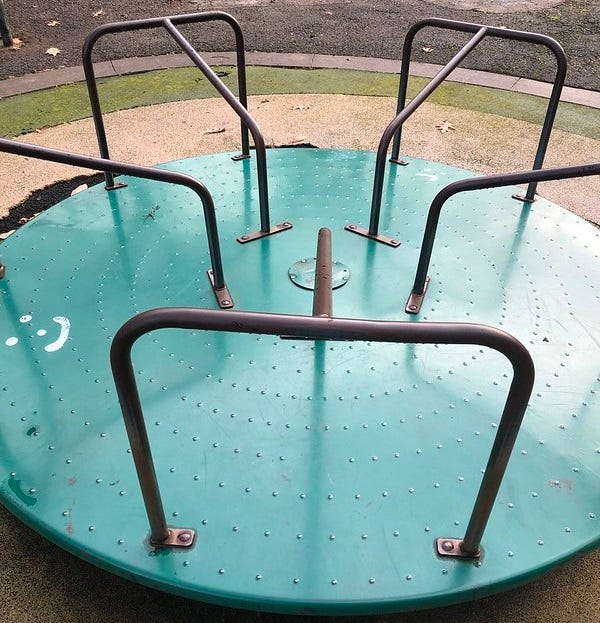 An old metal round-about in the playground at Sheraden Park in Pittsburgh.