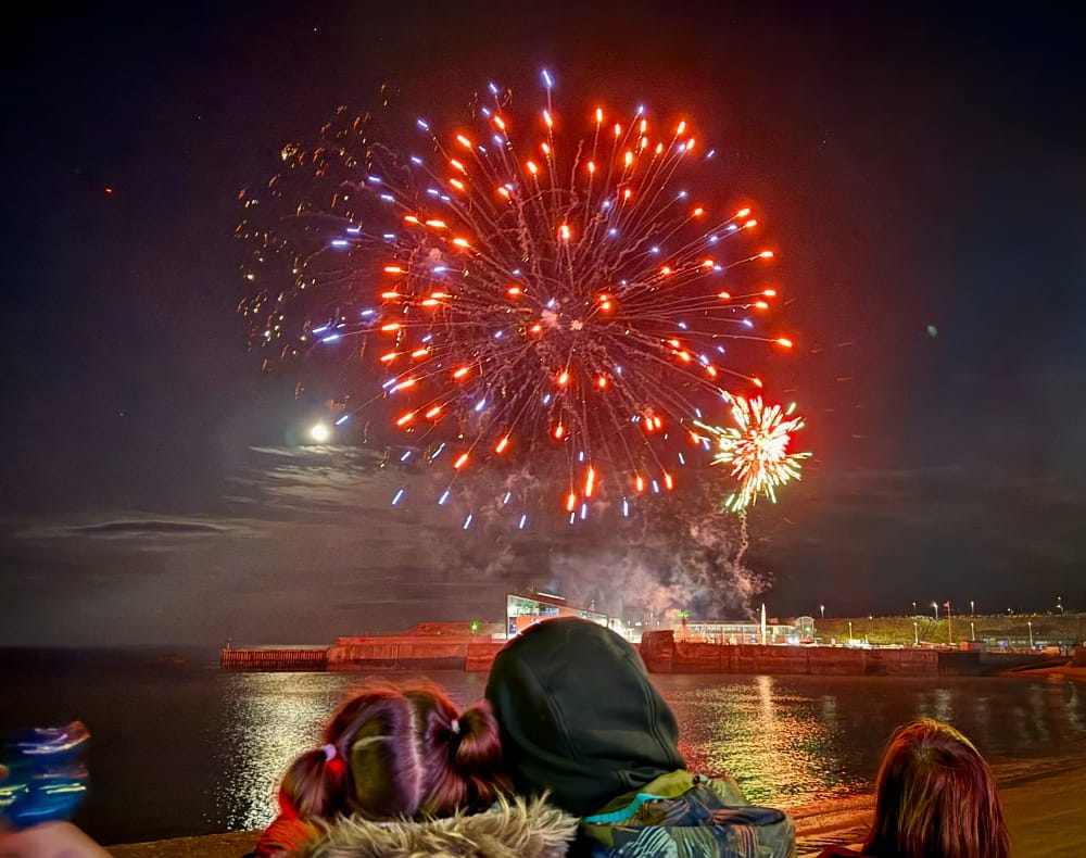 fireworks in Eyemouth Harbour that look a little like the death of the Death Star but in red.