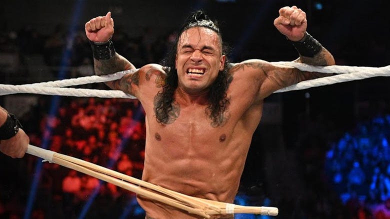Damian Priest getting hit with a kendo stick