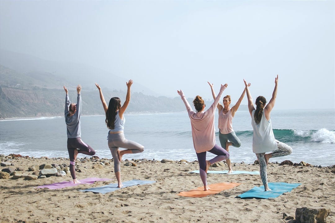 five woman standing on seashore five woman standing on seashore